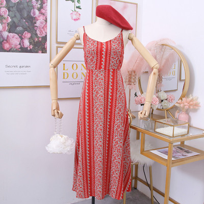 Alkalmi női ruha vékony pántokkal, sárga, piros és fekete mintával