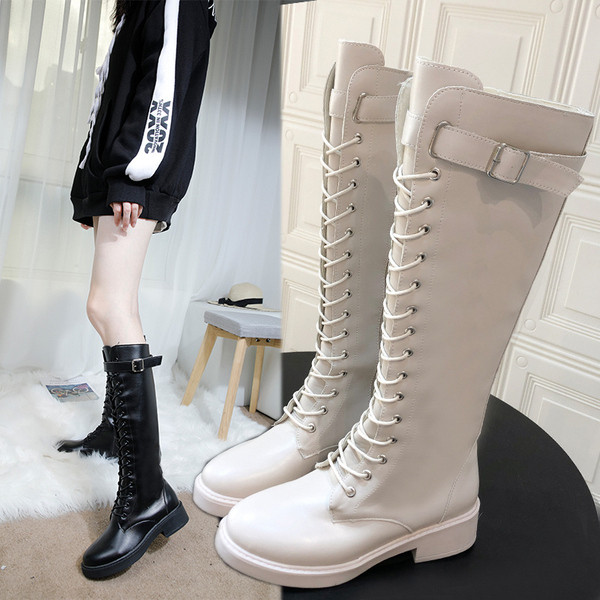 Fekete-fehér fűzős női téli bőrcsizma