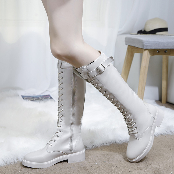 Fekete-fehér fűzős női téli bőrcsizma