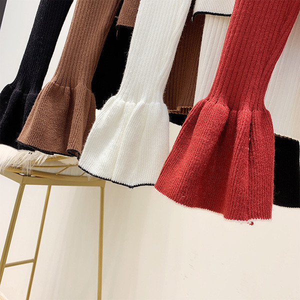 Modern női pulóver kerek nyakkivágással és lótusz ujjakkal