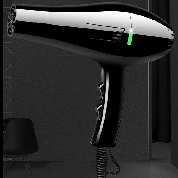 Powerful 2600W hair dryer for quick drying of hair with function for cold and hot air in black color