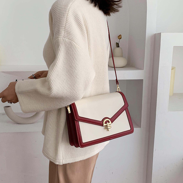 Geanta de dama cu element metalic cu maner lung