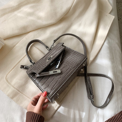 Női bőrtáska, hosszú és rövid fogantyús fém rögzítéssel