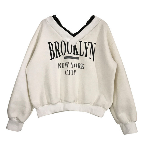 Bluză de damă cu decolteu spitz și aplicație în alb, maro și negru