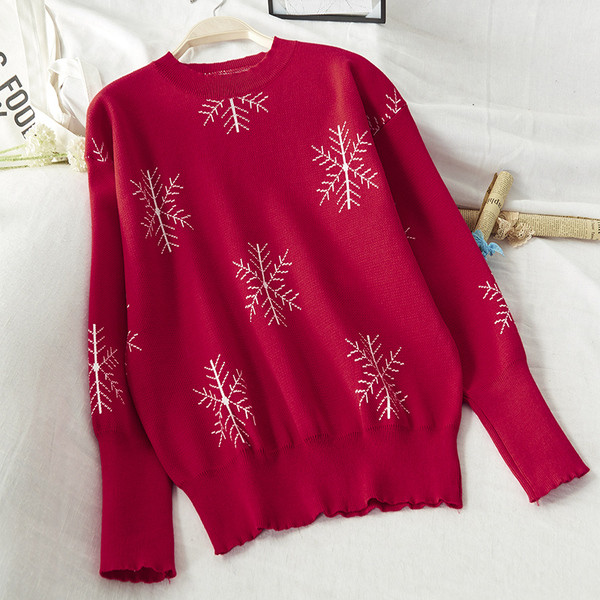 Női téli pulóver, piros karácsonyi motívumokkal