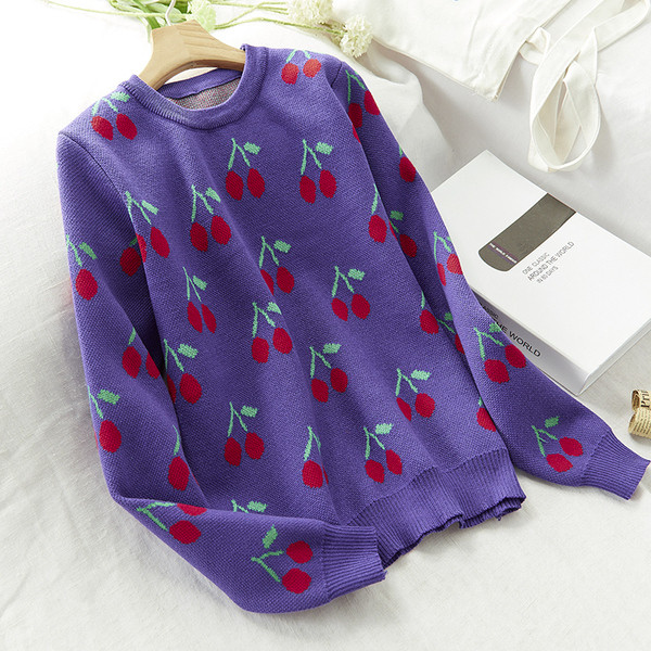 Női téli pulóver színes fekete-fehér hímzéssel