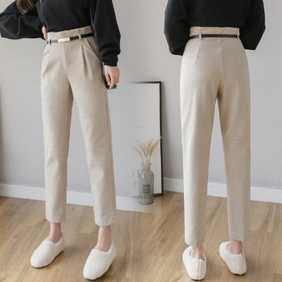 Elegáns női nadrág magas derékkal és övvel