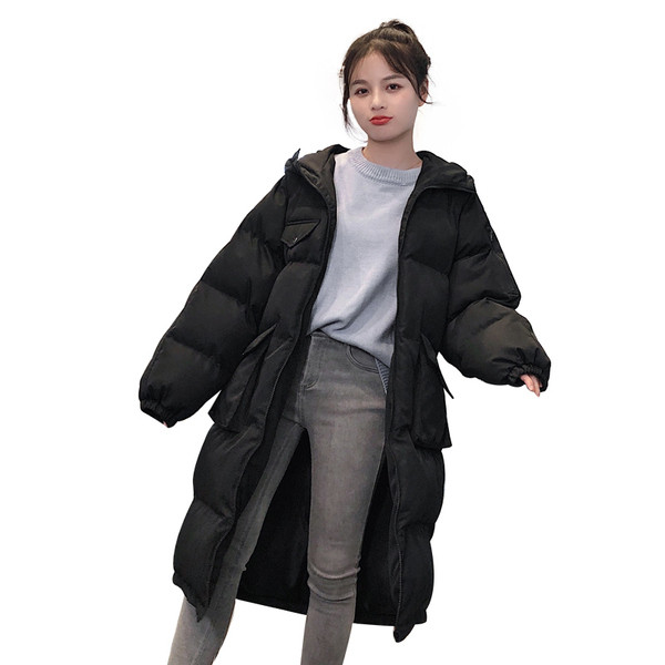 Hosszú modell női téli kabát nagy zsebekkel fehér és fekete színben