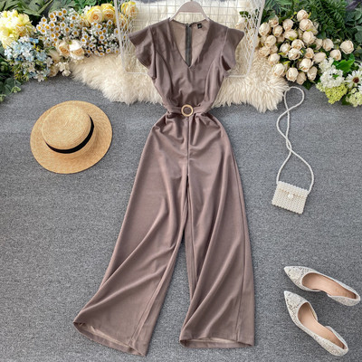 Női hosszú jumpsuit övvel és V-nyakú bordó, kék, zöld, fekete és szürke színekben