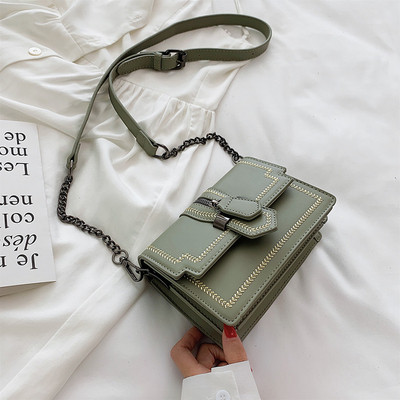 Μικρή οικολογική δερμάτινη τσάντα με λαβή ώμου σε κίτρινο, πράσινο, μαύρο και άσπρο χρώμα