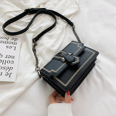 Μικρή οικολογική δερμάτινη τσάντα με λαβή ώμου σε κίτρινο, πράσινο, μαύρο και άσπρο χρώμα