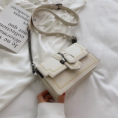 Μικρή οικολογική δερμάτινη τσάντα με λαβή ώμου σε κίτρινο, πράσινο, μαύρο και άσπρο χρώμα