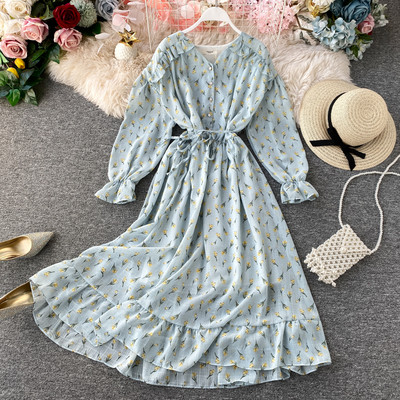 Rochie moderna de dama cu nasturi si model floral in alb, galben, albastru si roz