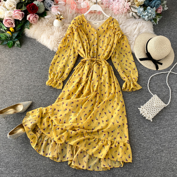 Rochie moderna de dama cu nasturi si model floral in alb, galben, albastru si roz