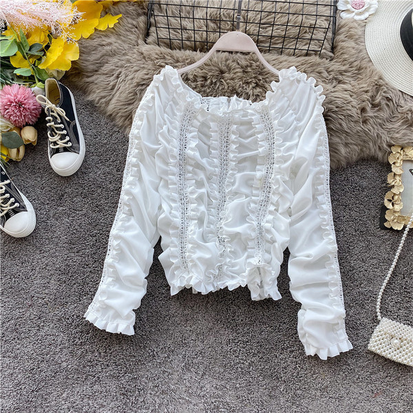 Modern női blúz csupasz váll és hosszú ujjú fekete, fehér és bézs színben