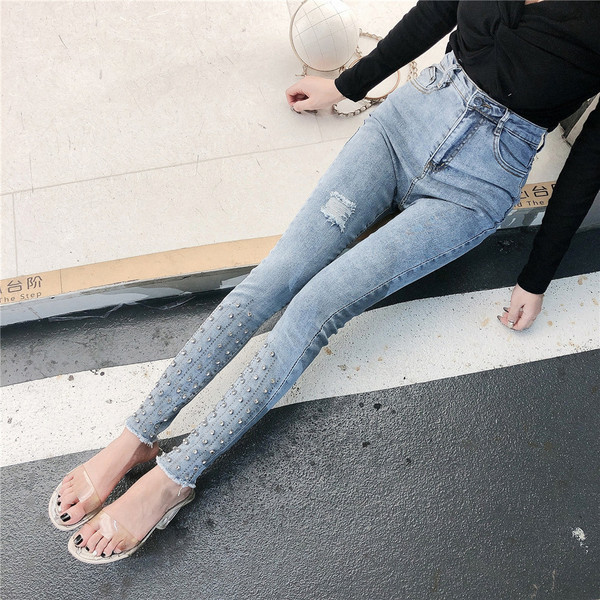 Modern női farmer kék színben, magas derékkal és díszítéssel - kövekkel