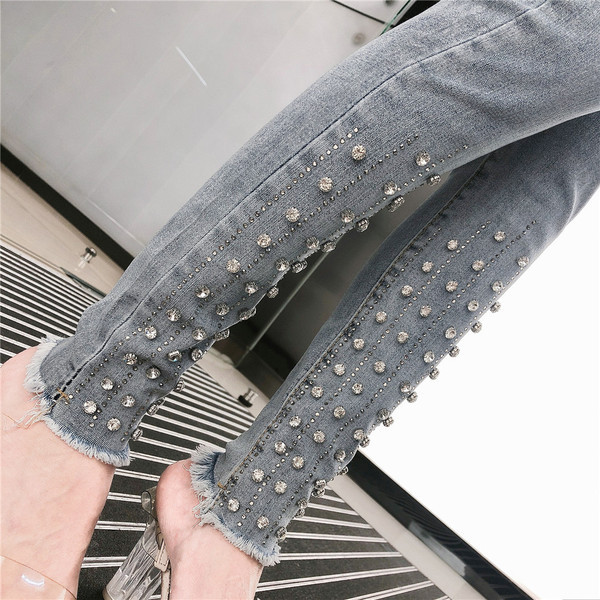 Modern női farmer kék színben, magas derékkal és díszítéssel - kövekkel