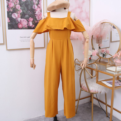 Modern női overál csupasz váll zöld, piros, sárga és fekete színekben