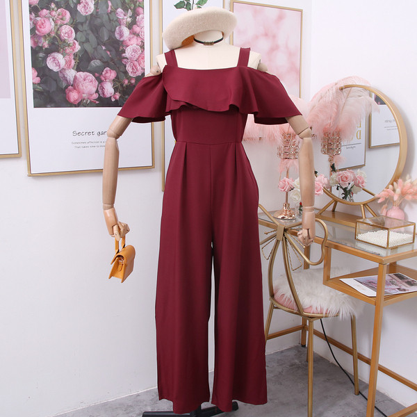 Modern női overál csupasz váll zöld, piros, sárga és fekete színekben