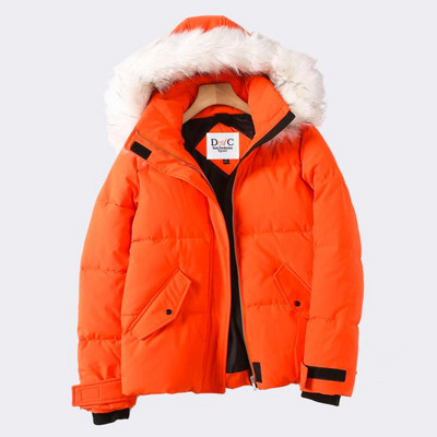 Vastag téli kabát cipzárral és kapucnival narancssárga pehelyszínnel