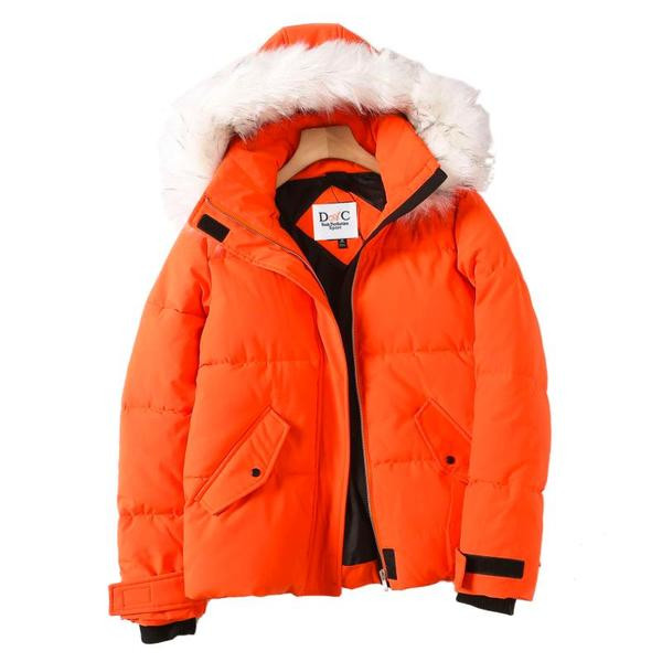 Vastag téli kabát cipzárral és kapucnival narancssárga pehelyszínnel