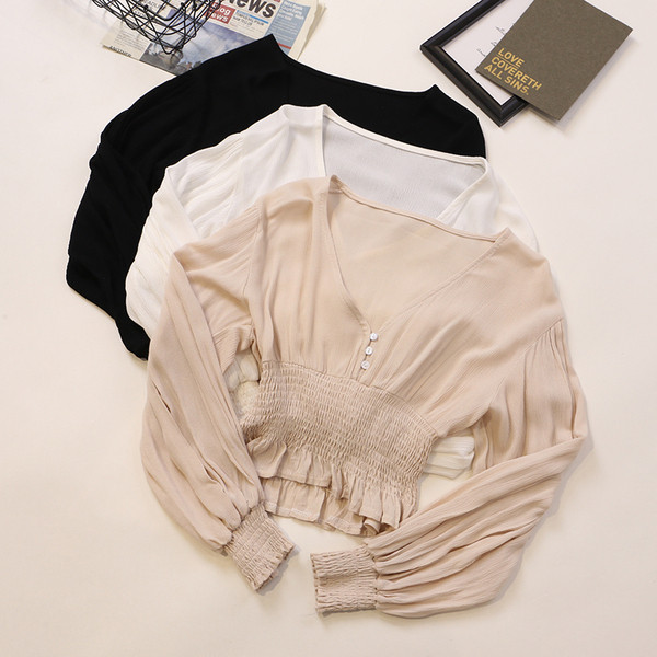 Κομψή γυναικεία μπλούζα σε διάφορα χρώματα με V-λαιμόκοψη και κουμπιά