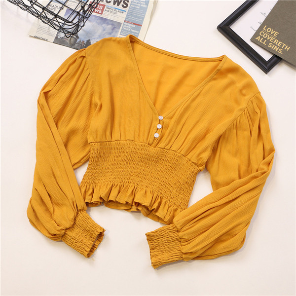 Κομψή γυναικεία μπλούζα σε διάφορα χρώματα με V-λαιμόκοψη και κουμπιά