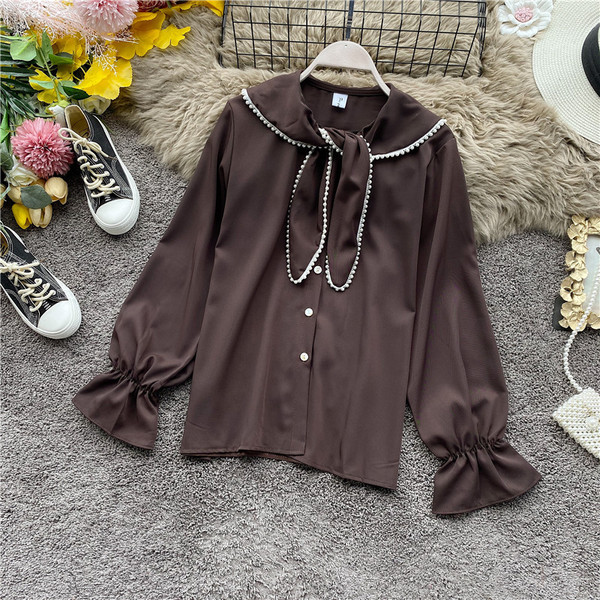 Modern női ing gombokkal és gyöngyökkel fekete, barna, fehér és bordó színben