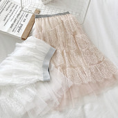 Modern női szoknya fekete, fehér és bézs színben, rugalmas derékkal