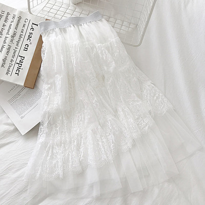 Modern női szoknya fekete, fehér és bézs színben, rugalmas derékkal