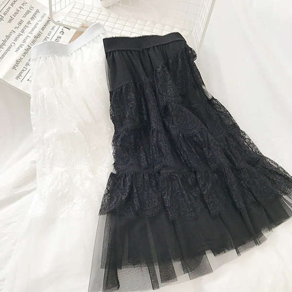 Modern női szoknya fekete, fehér és bézs színben, rugalmas derékkal