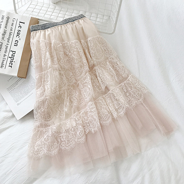 Modern női szoknya fekete, fehér és bézs színben, rugalmas derékkal