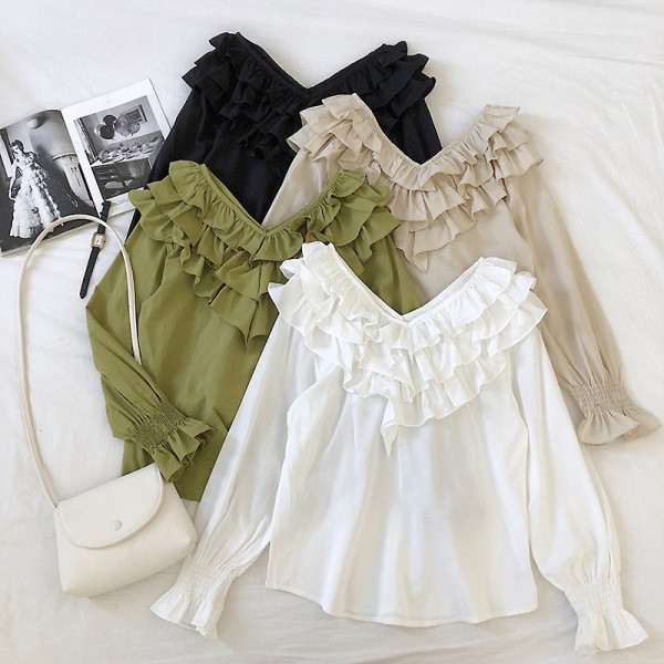 Modern női blúz négy színben V-nyakkal és fürtökkel