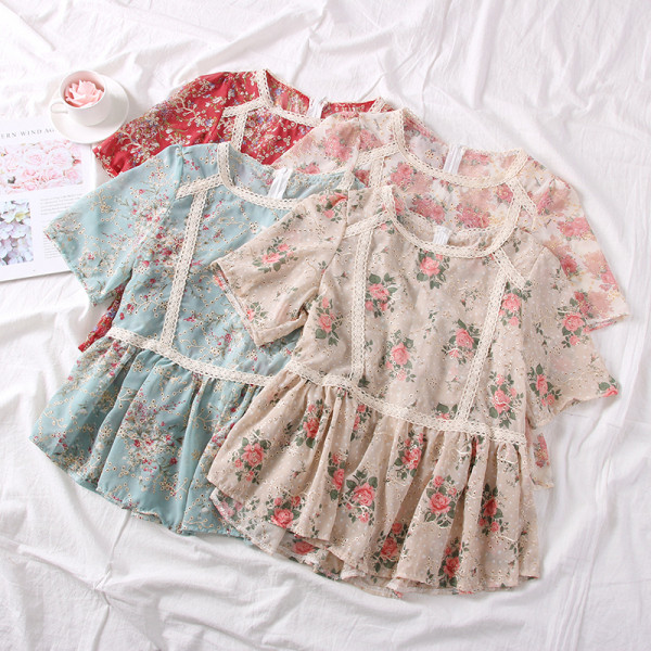 Modern női blúz ovális nyakkivágással és virágmotívumokkal