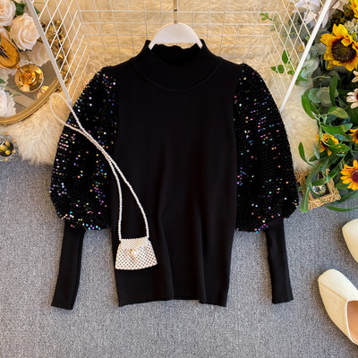 Modern női pulóver széles ujjal és flitterekkel piros, fehér és fekete színben