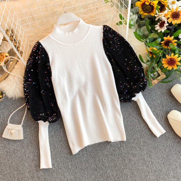 Modern női pulóver széles ujjal és flitterekkel piros, fehér és fekete színben