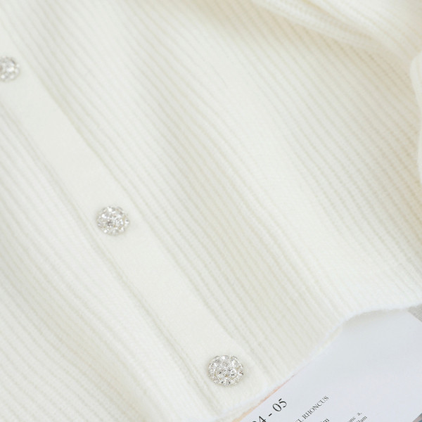 Új modell női kardigán fekete-fehér gombokkal