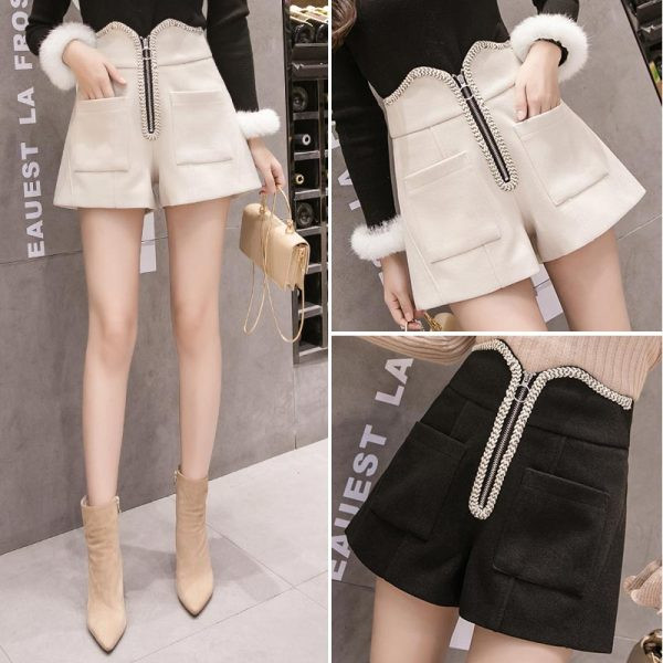 Fekete és bézs színű női rövidnadrág zsebekkel és cipzárral