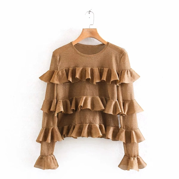 Modern női blúz arany színben, ovális nyakkivágással és hosszú ujjakkal