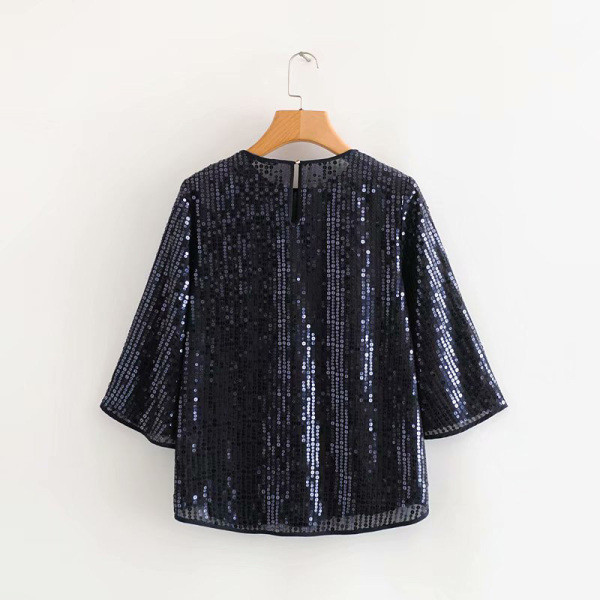 Rövid, széles blúz 3/4 ujjal, fekete és szürke színben, flitterekkel