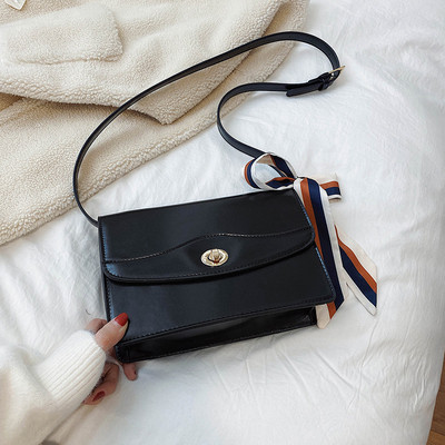 Modern női táska szalaggal és hosszú füllel barna, fekete, kék és bordó színben