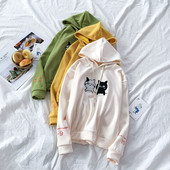 Zöld, sárga és bézs színű női pulóver rátéttel és kapucnival