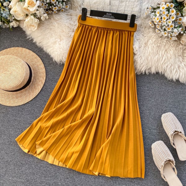 Női hajtogatott szoknya magas derékkal és övvel, kék, sárga, piros és bézs színben