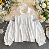 Stílusos női ing fehér és fekete színben klasszikus gallérral és széles ujjakkal