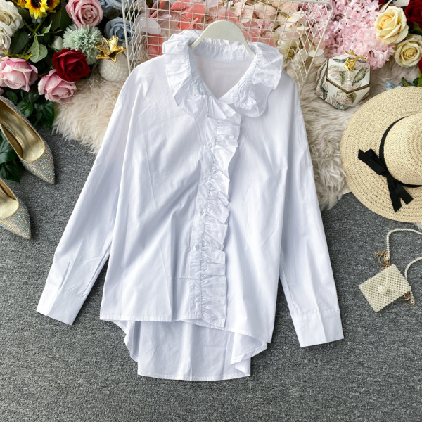 Modern női ing gombokkal és narancssárga, fehér, fekete és bézs színű fürtökkel