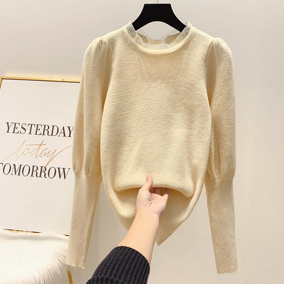 Női téli pulóver szalaggal a hátán és széles ujjakkal fehér, fekete, sárga és fekete színben