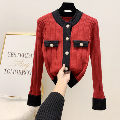 Női téli mellény fekete, piros és bézs gombokkal