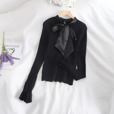 Rózsaszín, fehér és fekete női pulóver szalaggal és lótusz ujjal