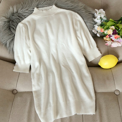 Női pulóver az ujjakon gombokkal és félmagas gallérral bordó, fehér, fekete, zöld, kék és barna színekben