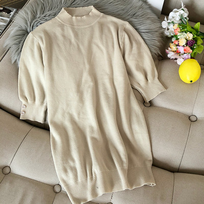 Női pulóver az ujjakon gombokkal és félmagas gallérral bordó, fehér, fekete, zöld, kék és barna színekben